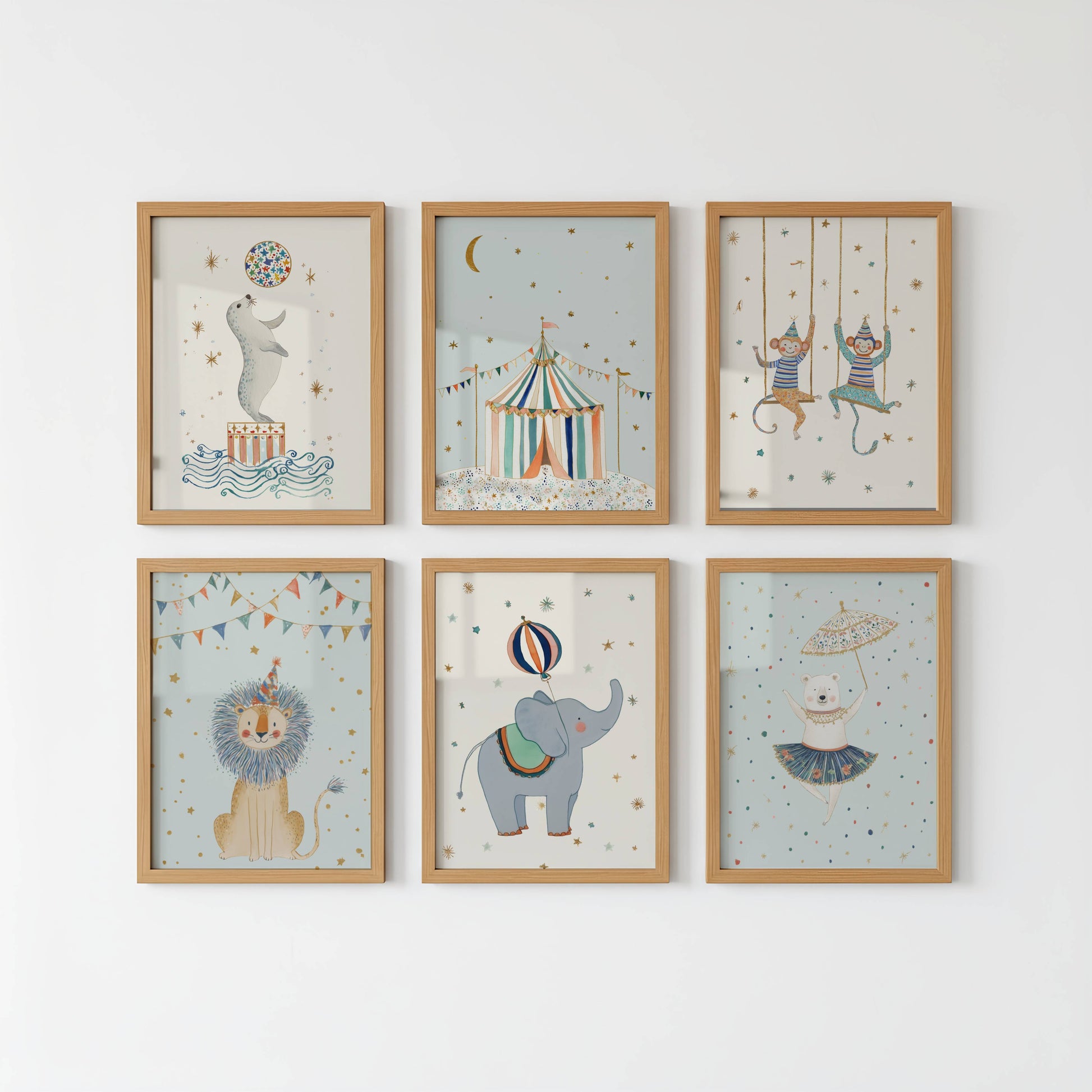Blue Circus Nursery Wall Art Set of 6 shown in white frames on a plain white wall — Sarah Gallagher Design