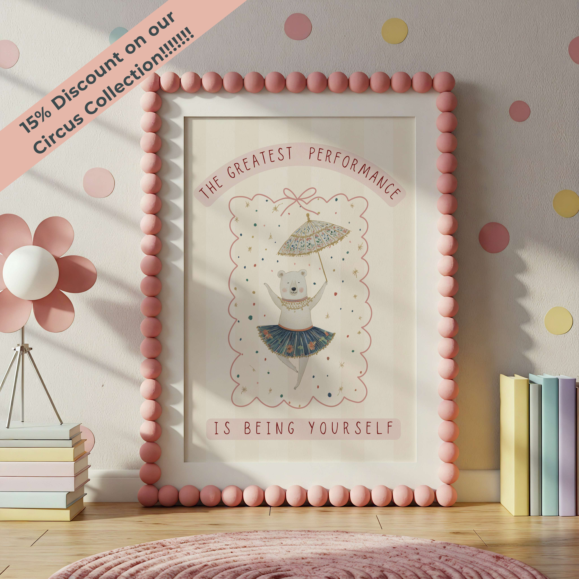 Framed artwork with a bear illustration and motivational quote in a room with polka dot wallpaper.
