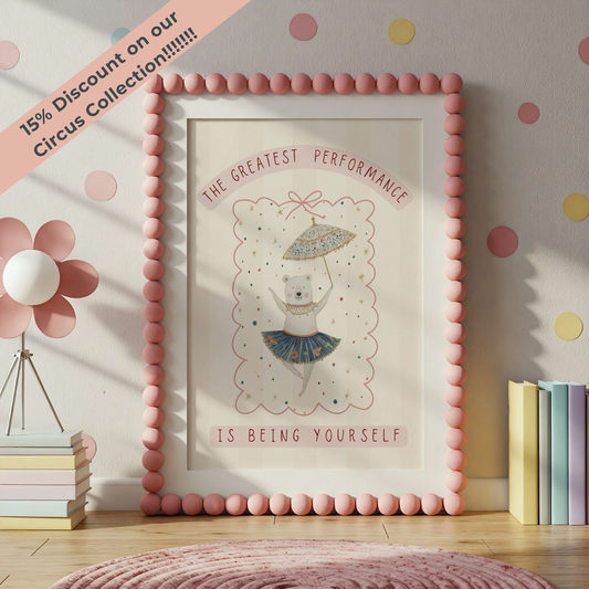 Framed artwork with a bear illustration and motivational quote in a room with polka dot wallpaper.
