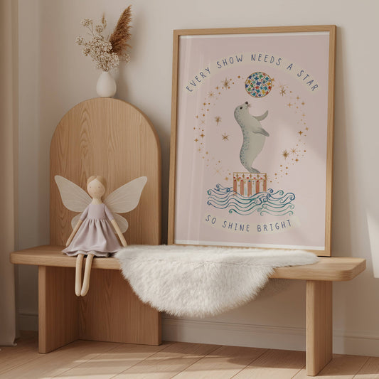 A framed print of a circus seal with motivational words