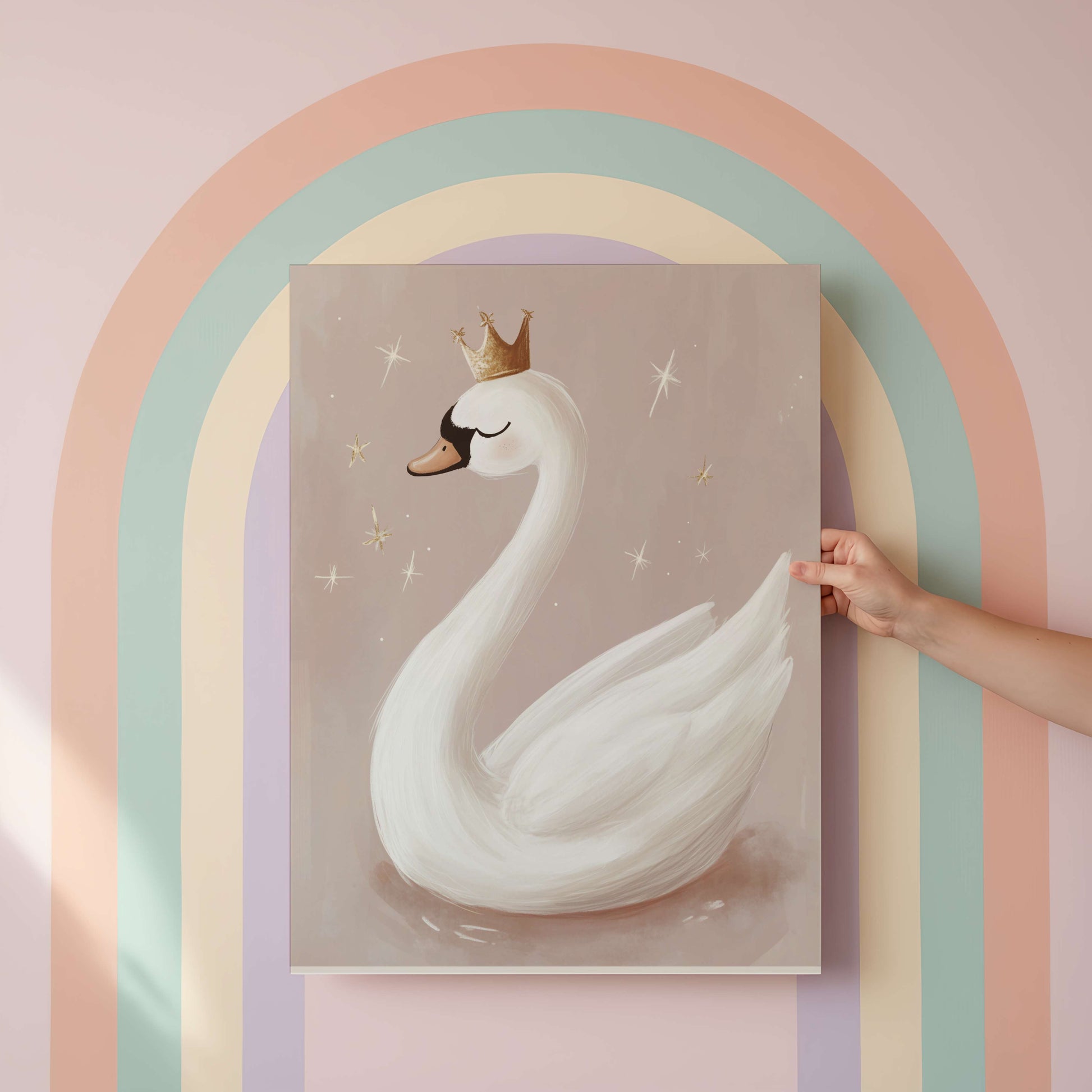 Framed artwork of a swan with a crown against a pastel rainbow arch.