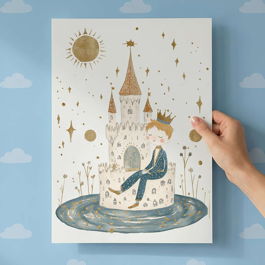 Hand holding a children's poster with a castle and prince design against a blue wall with cloud patterns.