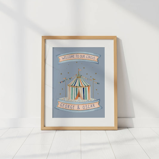 Framed artwork of a circus tent with 'Welcome to our circus' and 'George & Oscar' text on a light background.