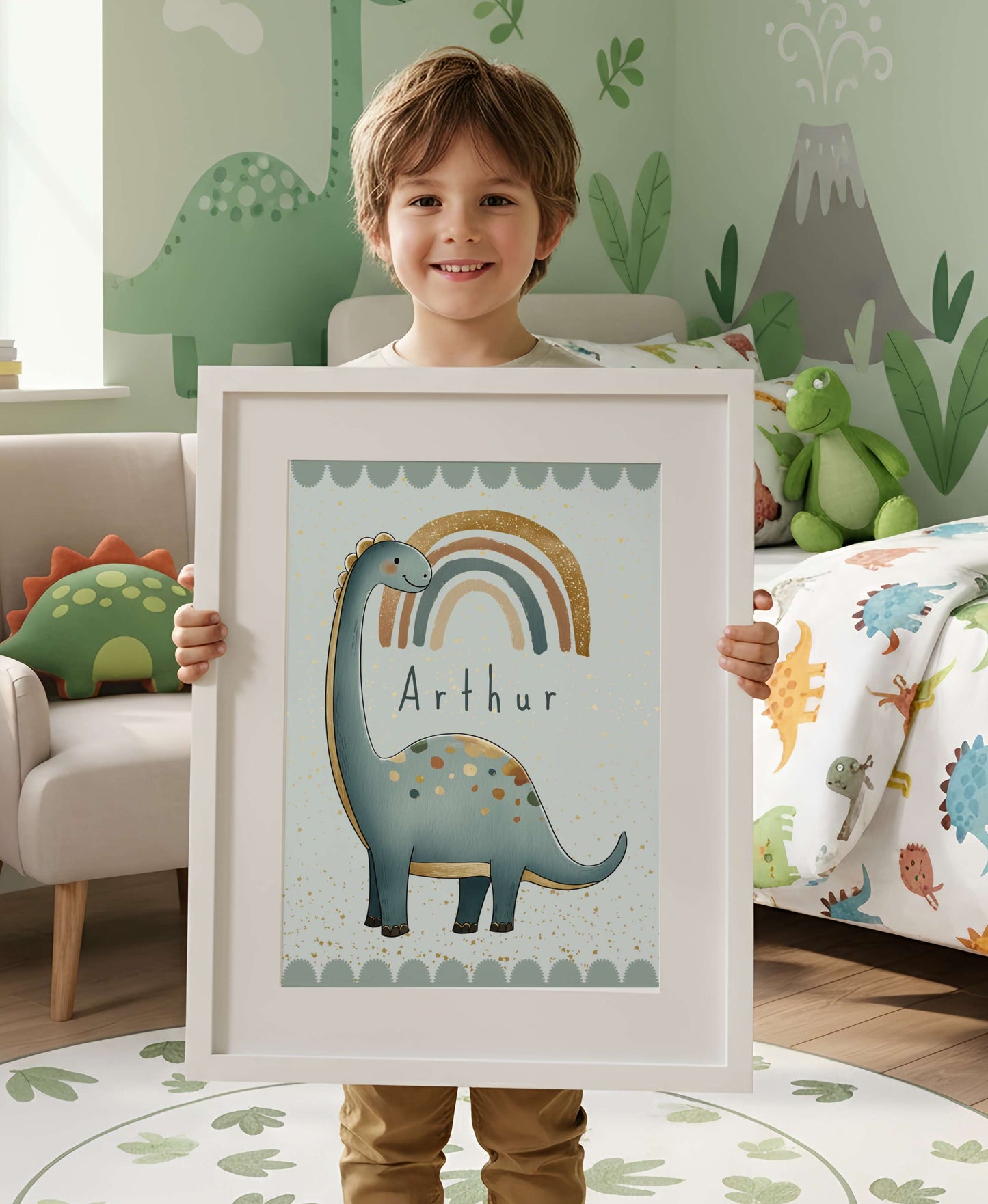 Child holding a framed picture of a dinosaur with 'Arthur' on it, in a room with dinosaur-themed decor.
