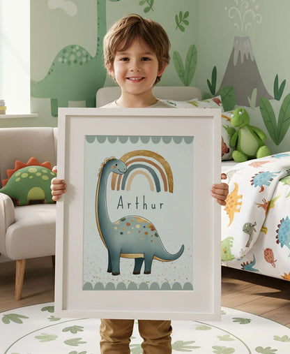Child holding a framed picture of a dinosaur with 'Arthur' on it, in a room with dinosaur-themed decor.