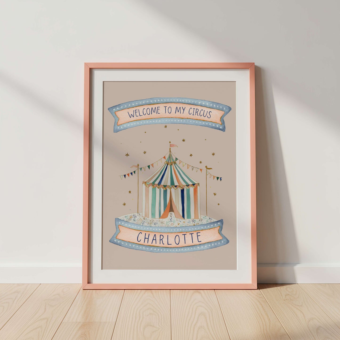 Framed artwork with a circus tent design and 'Welcome to my circus' text on a pink background.