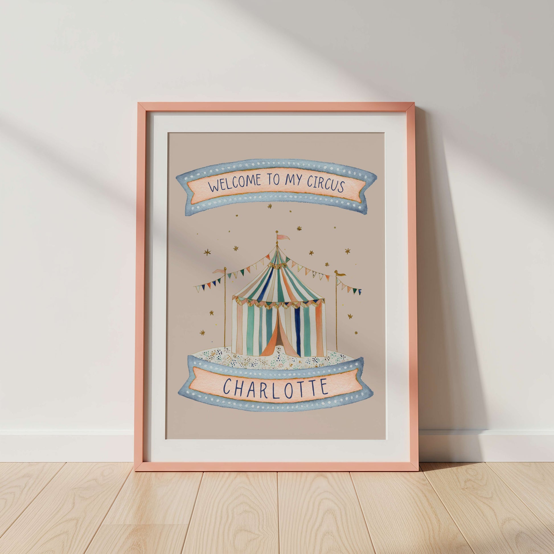 Framed artwork with a circus tent design and 'Welcome to my circus' text on a pink background.