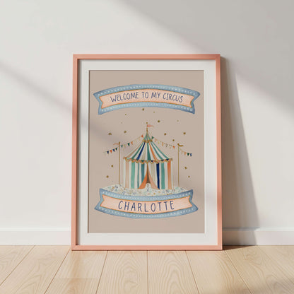 Framed artwork with a circus tent design and 'Welcome to my circus' text on a pink background.