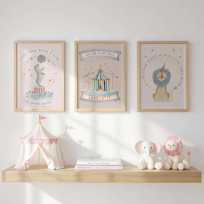 Three framed Circus prints on a wall above a wooden shelf with toys and books.