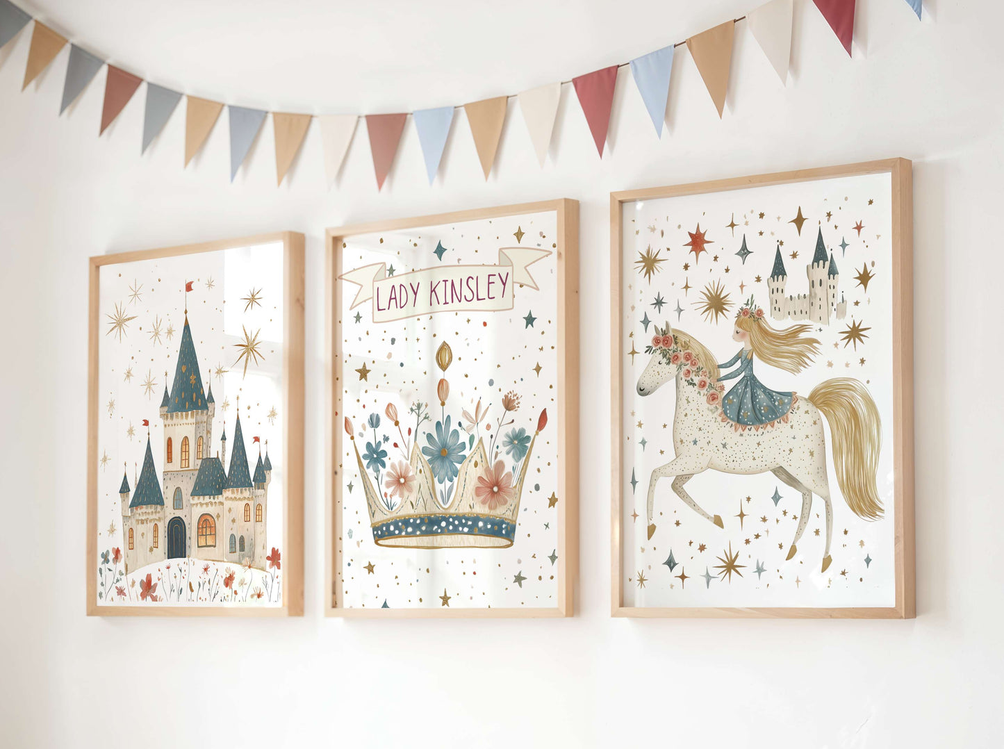 Three framed fairy tale themed illustrations on a wall with a decorative banner above.