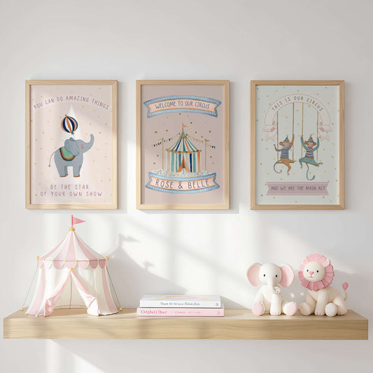 Three framed Circus themed prints on a wall above a shelf with toys and books.