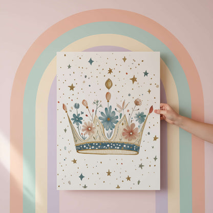 Hand holding a poster with a floral crown design against a pastel rainbow arch.