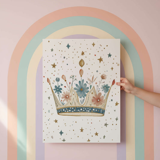 Hand holding a poster with a floral crown design against a pastel rainbow arch.