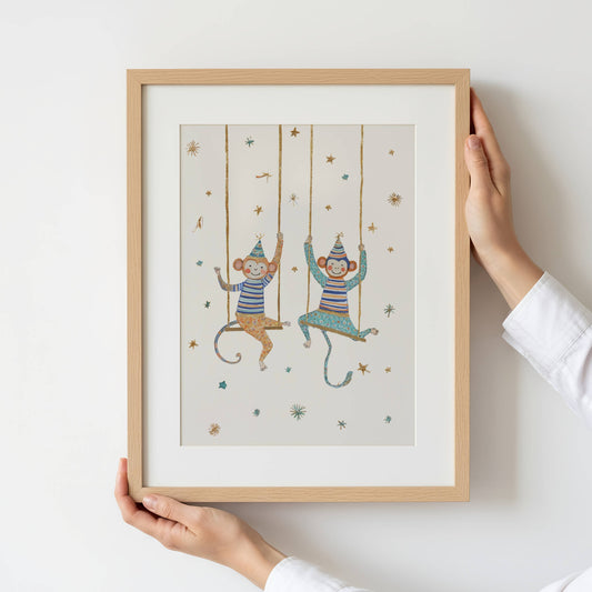 Framed artwork of two monkeys on swings in a circus setting