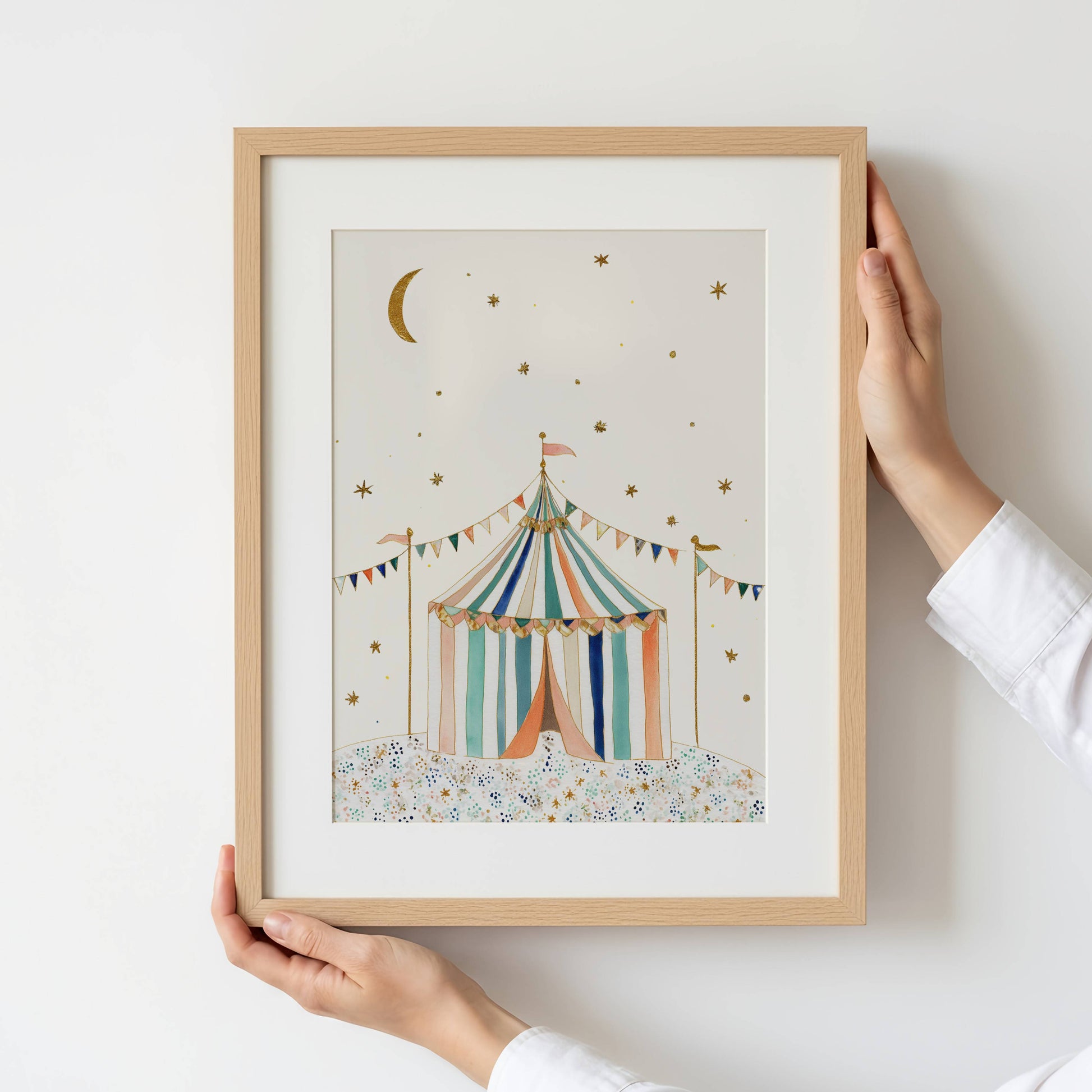 The Circus Tent vintage circus nursery print — striped big-top tent with golden stars and bunting — held up against a light background